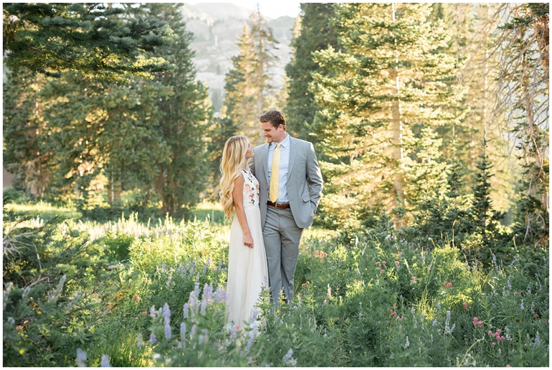 engagements, sunlight, mountains, wildflowers, mountain engagments, summer engagements, hair goals, engagement dresses, floral dress, grey suit, www.kristinacurtisphotography.com