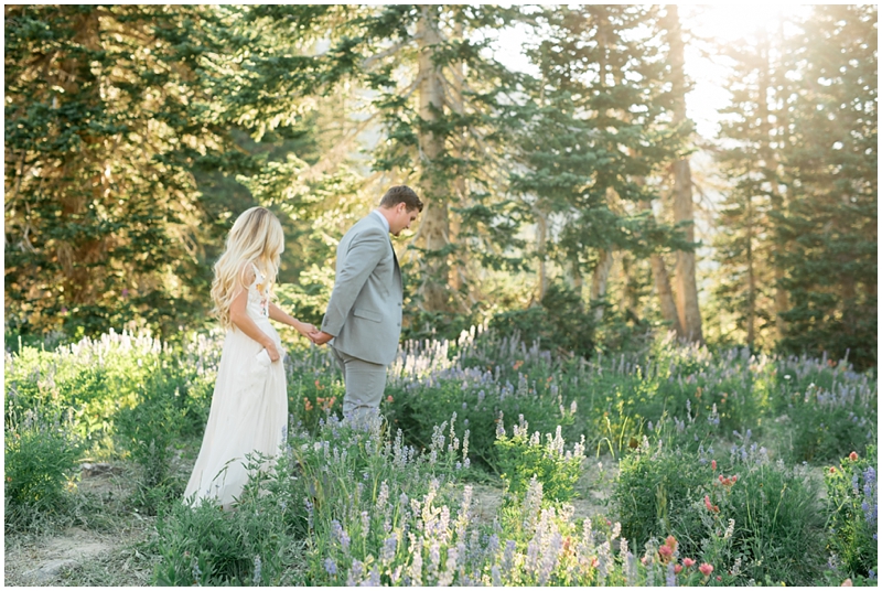 engagements, sunlight, mountains, wildflowers, mountain engagments, summer engagements, hair goals, engagement dresses, floral dress, grey suit, www.kristinacurtisphotography.com
