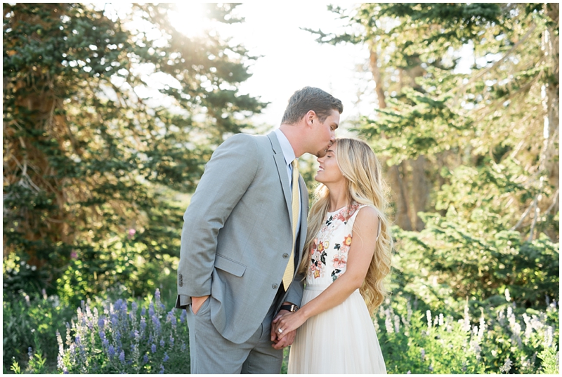 engagements, sunlight, mountains, wildflowers, mountain engagments, summer engagements, hair goals, engagement dresses, floral dress, grey suit, www.kristinacurtisphotography.com