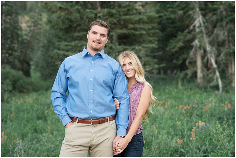 engagements, sunlight, mountains, wildflowers, mountain engagments, summer engagements, hair goals, engagement dresses, floral dress, grey suit, www.kristinacurtisphotography.com