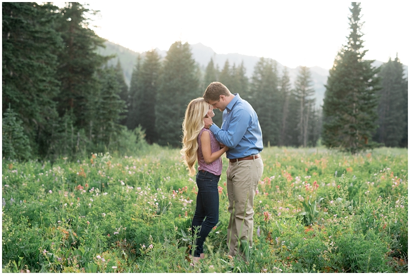 engagements, sunlight, mountains, wildflowers, mountain engagments, summer engagements, hair goals, engagement dresses, floral dress, grey suit, www.kristinacurtisphotography.com