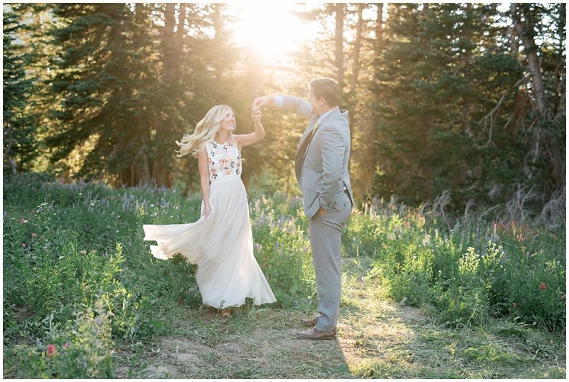 engagements, sunlight, mountains, wildflowers, mountain engagments, summer engagements, hair goals, engagement dresses, floral dress, grey suit, www.kristinacurtisphotography.com