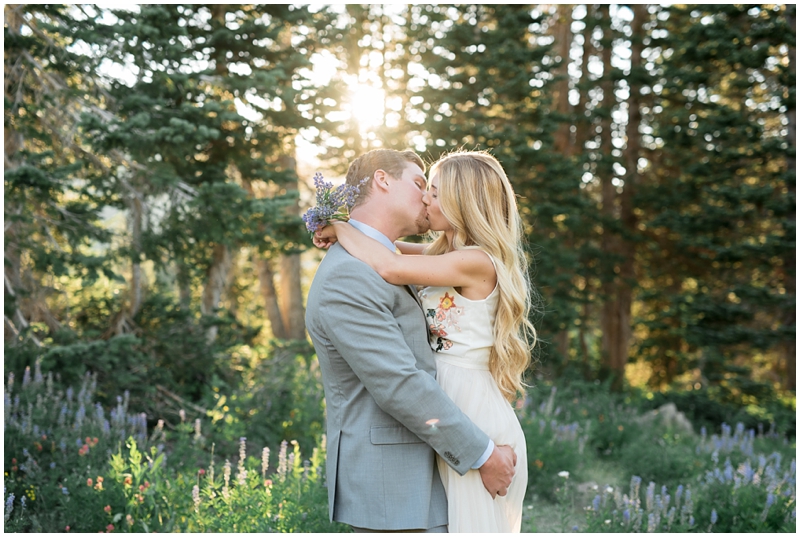 engagements, sunlight, mountains, wildflowers, mountain engagments, summer engagements, hair goals, engagement dresses, floral dress, grey suit, www.kristinacurtisphotography.com