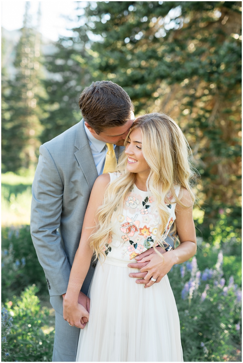 engagements, sunlight, mountains, wildflowers, mountain engagments, summer engagements, hair goals, engagement dresses, floral dress, grey suit, www.kristinacurtisphotography.com